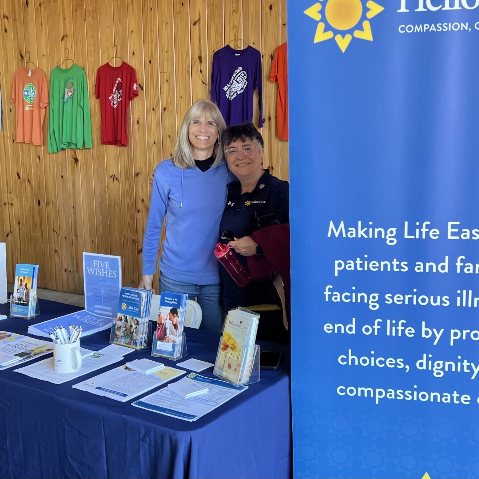 Two people standing in barn
