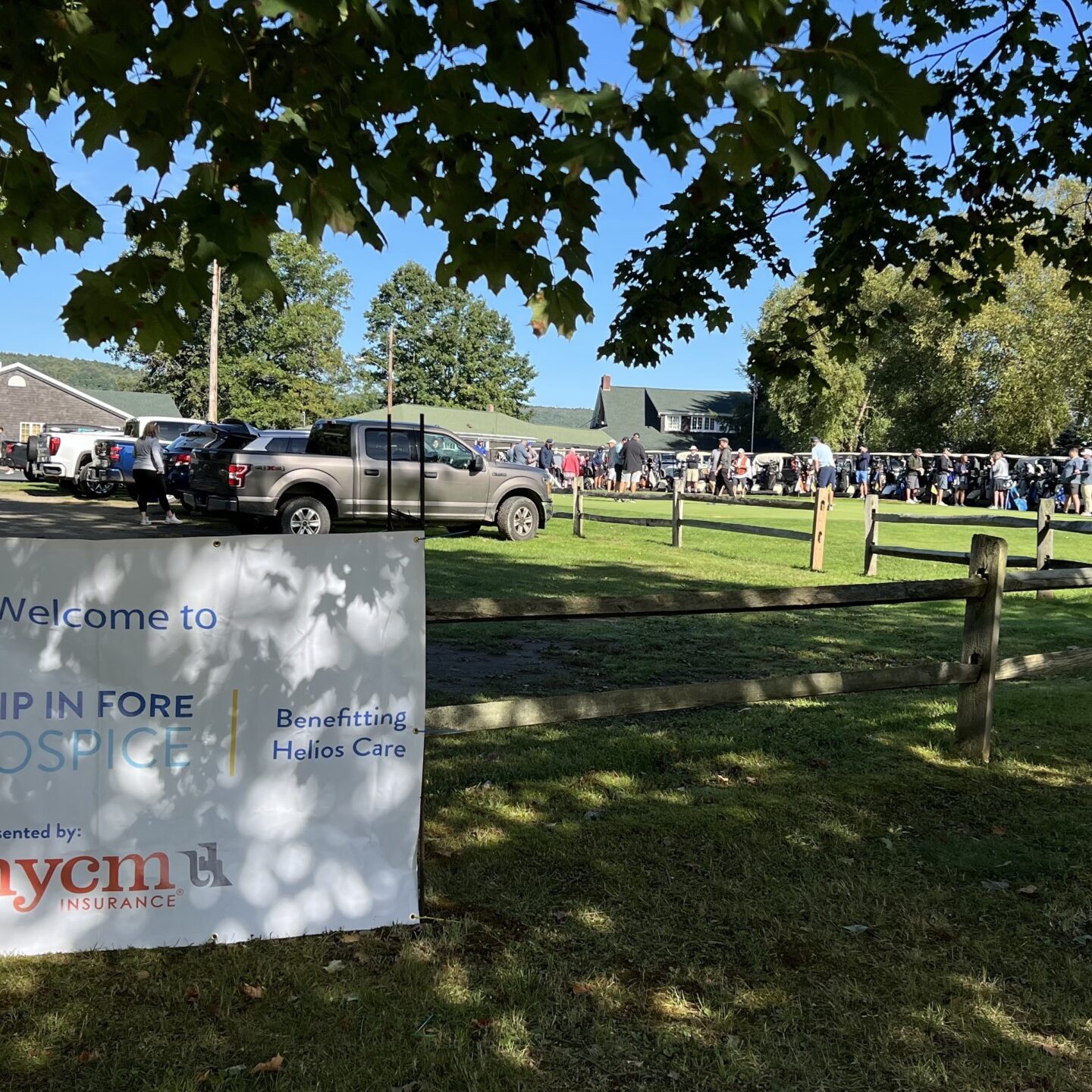 Sign hanging on fence