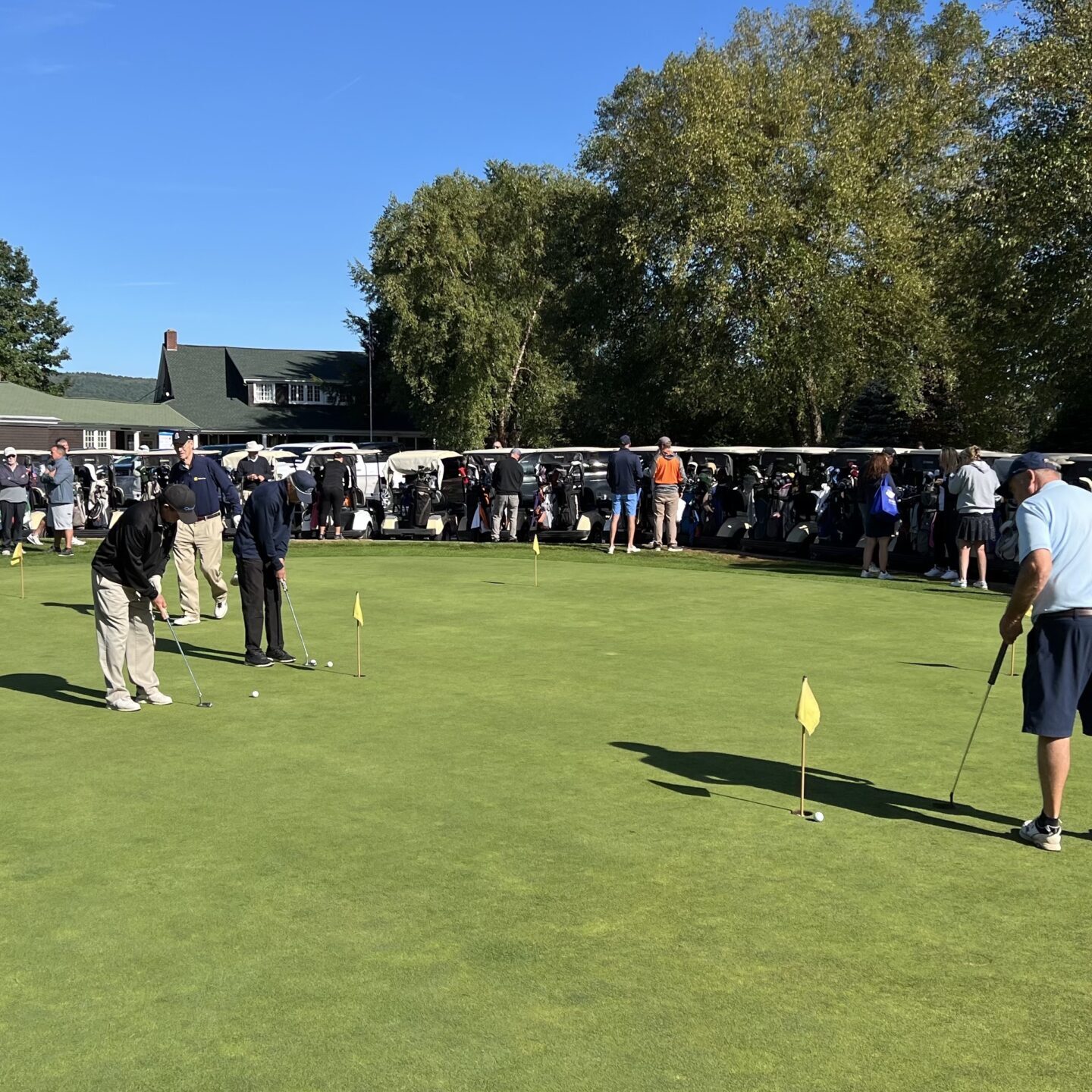 People playing golf on the green