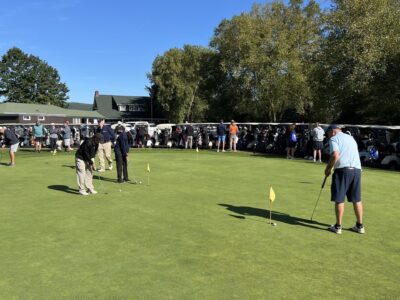 People playing golf on the green