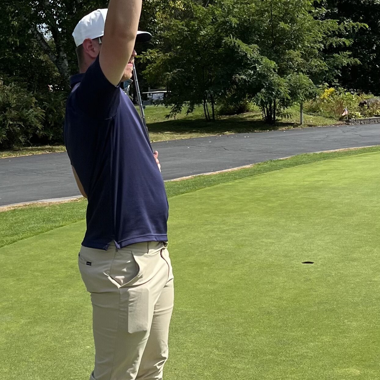 Man standing with his arm up in the air