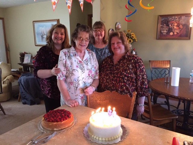Ruth – 80th B-day with daughters Woman standing with her children