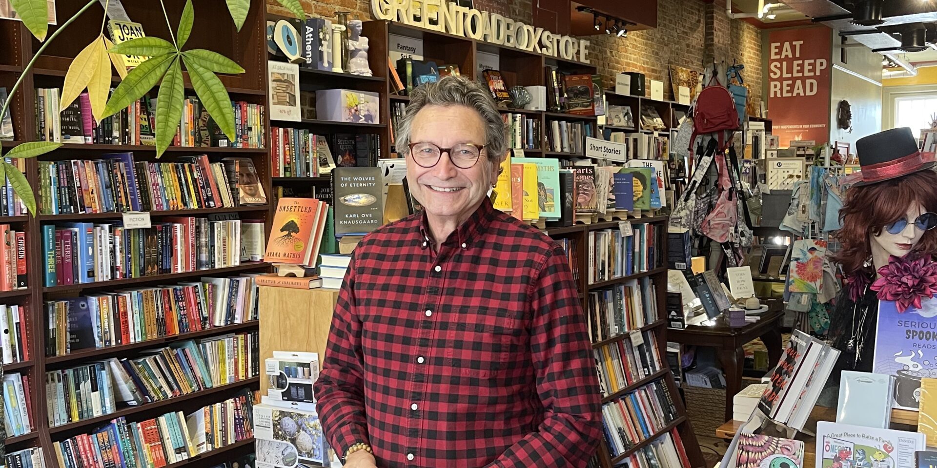 jim havener Man holding a book and standing in bookstore